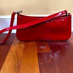 Red patent Neiman Marcus Collection handbag. Very good condition. A few marks.